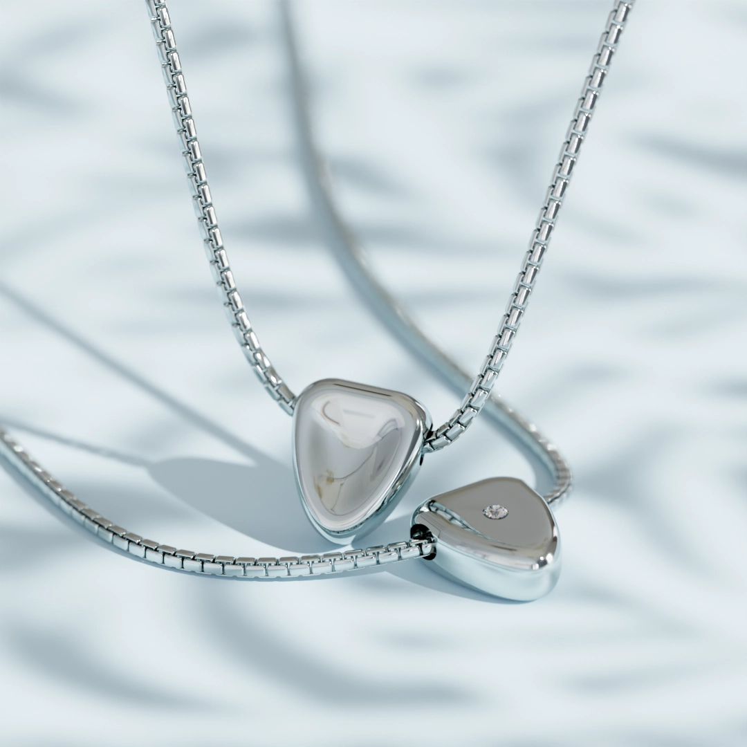 product render of necklaces with an inset diamond on simple pastel scene