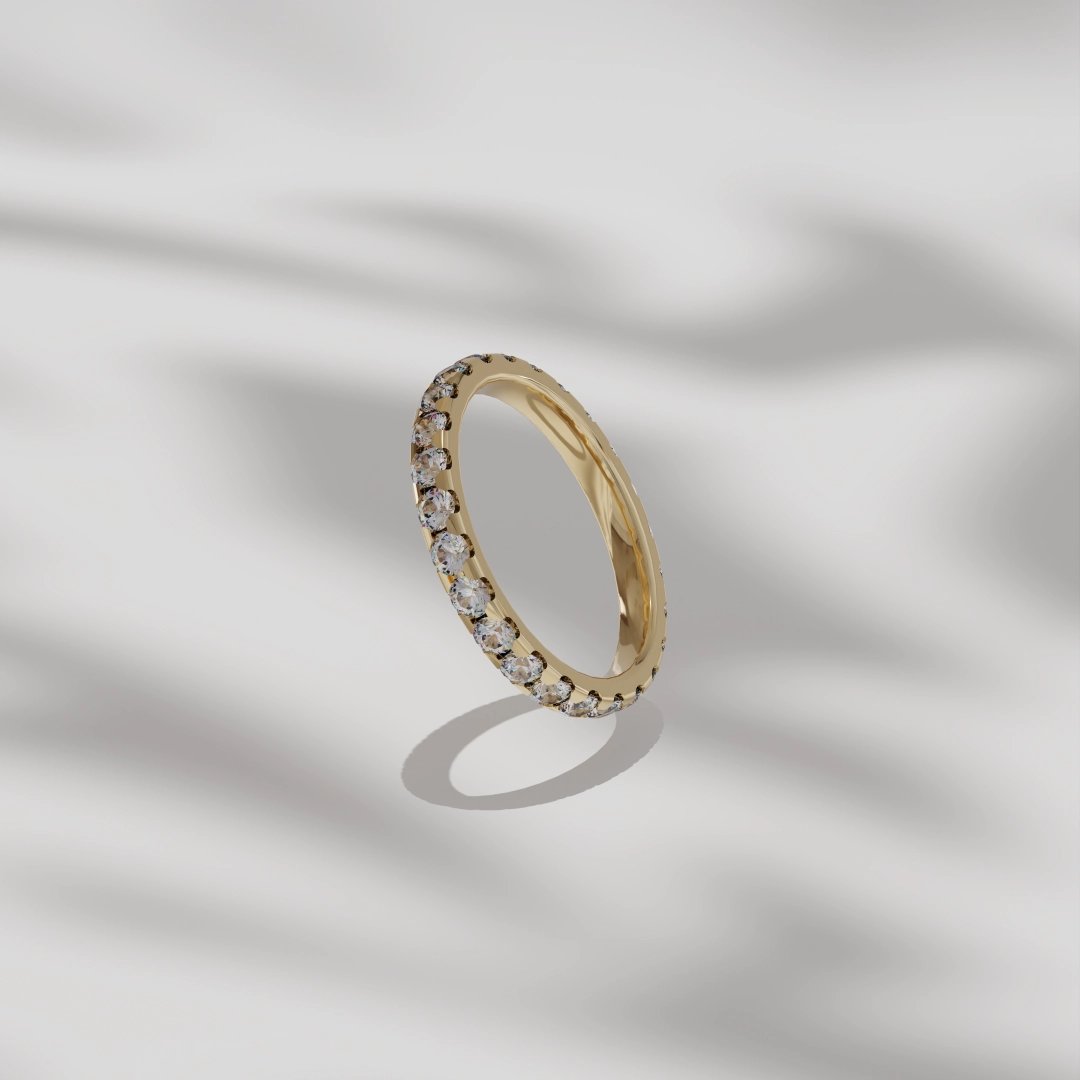 product render of ring with inset diamonds on simple pastel scene