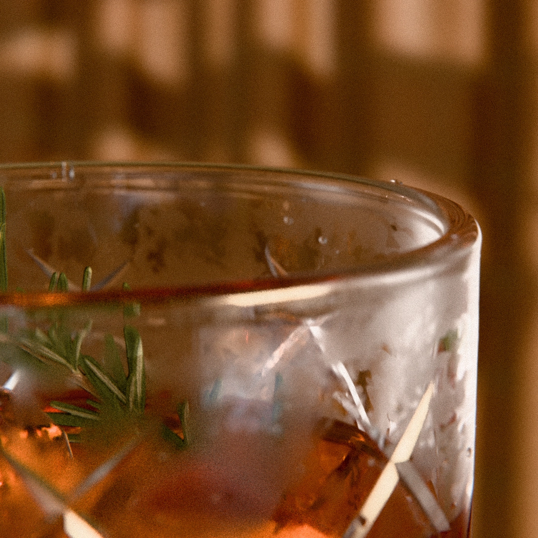 product render of a negroni cocktail on a table